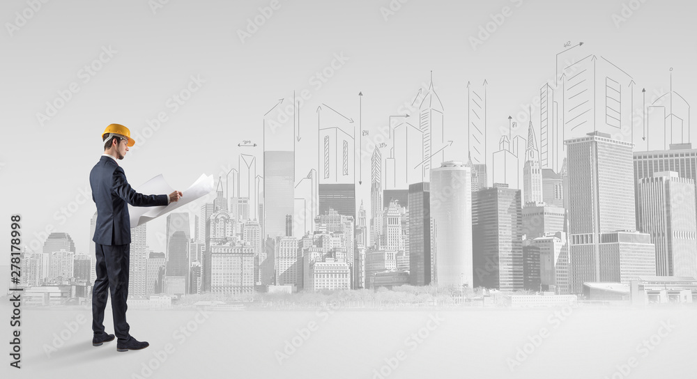 Young supervisor architect standing and replanning a big city panorama Young supervisor architect standing and replanning a big city panorama