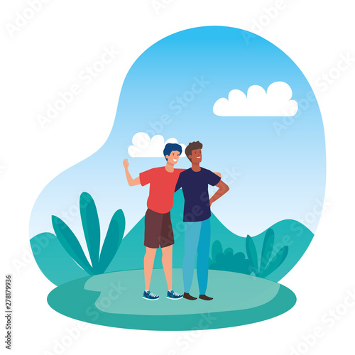 interracial young men friends celebrating in the park