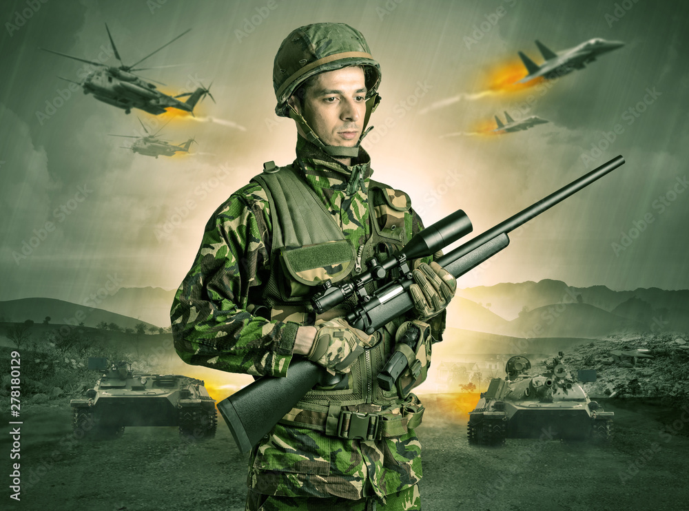 Armed soldier with sniper in the middle of a war Armed soldier with sniper in the middle of a war