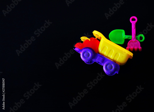 Toy truck on a black background.