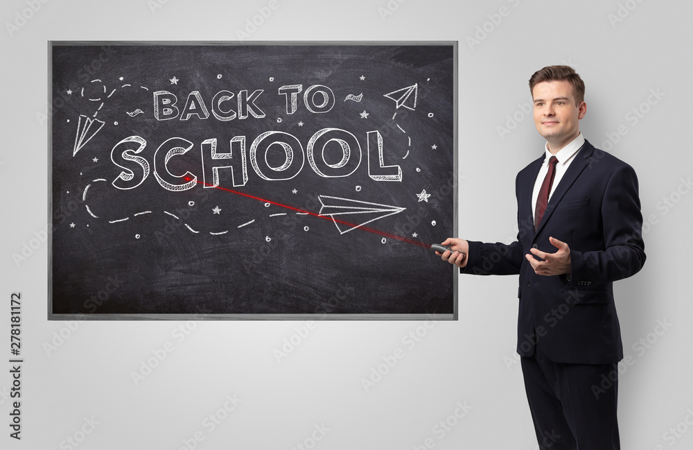 Handsome young teacher with laser pointer teaching Handsome young teacher with laser pointer teaching