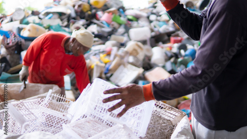 Workers are sorting plastic waste in the garbage factory