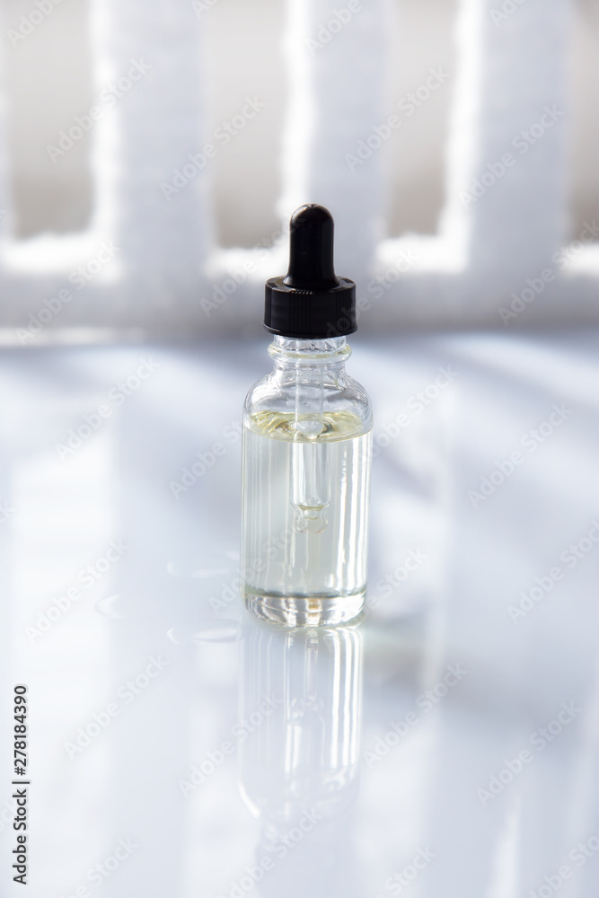 Dropper glass bottle with pipette. Mock up Essential liquid . Dropper glass bottle with pipette. Mock up Essential liquid .
