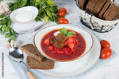 Traditional Ukrainian borsch with beef and sour cream
