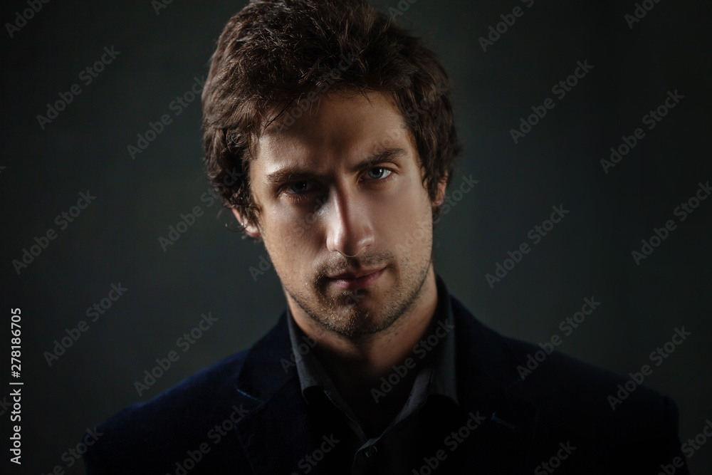 Young thoughtful handsome man with a light stubble on his face. Young thoughtful handsome man with a light stubble on his face.