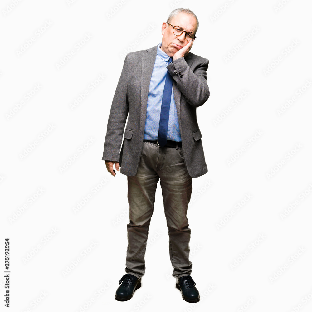 Handsome senior businesss man wearing glasses and tie thinking looking tired and bored with depression problems with crossed arms.