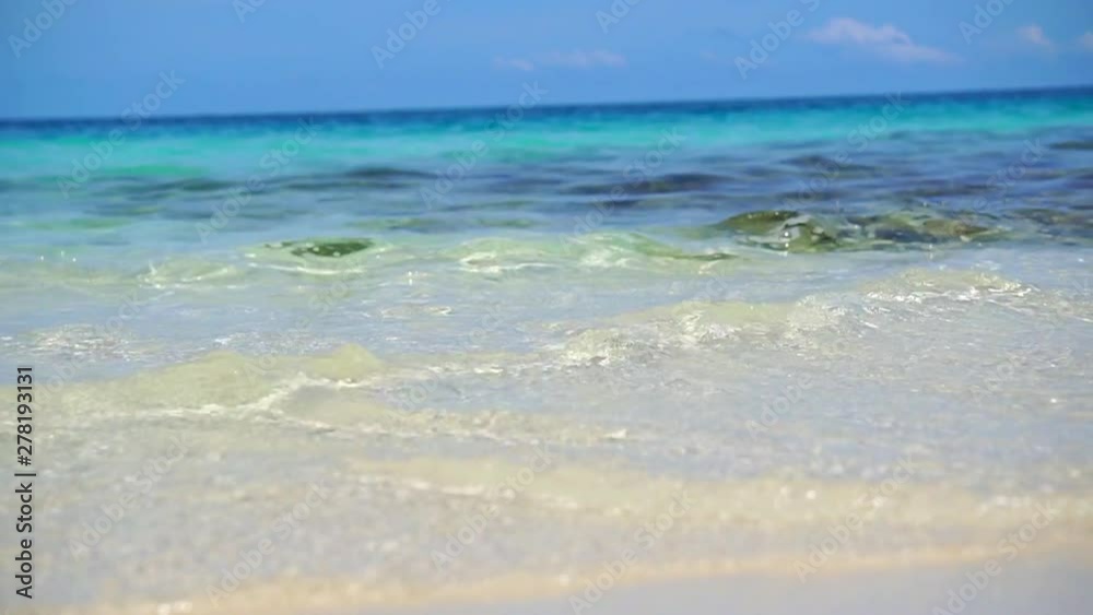 Low angle wave of clear ocean Maldives white sand slow motion Low angle wave of clear ocean Maldives white sand slow motion