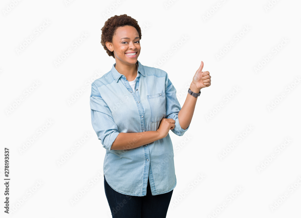 Young beautiful african american woman over isolated background Looking proud, smiling doing thumbs up gesture to the side Young beautiful african american woman over isolated background Looking proud, smiling doing thumbs up gesture to the side