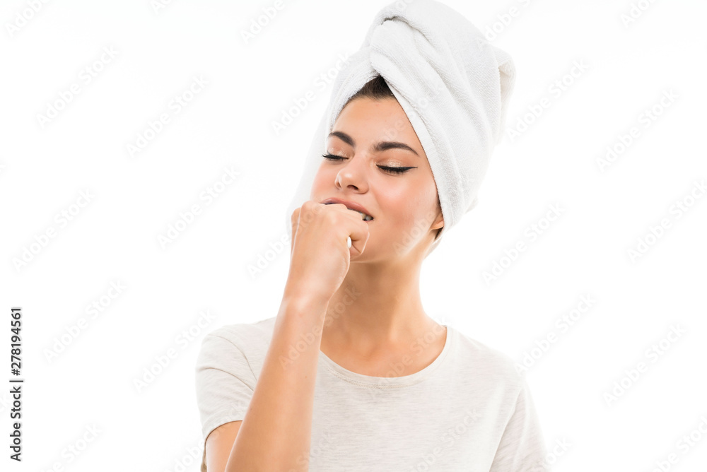 Teenager girl over isolated white background brushing her teeths Teenager girl over isolated white background brushing her teeths