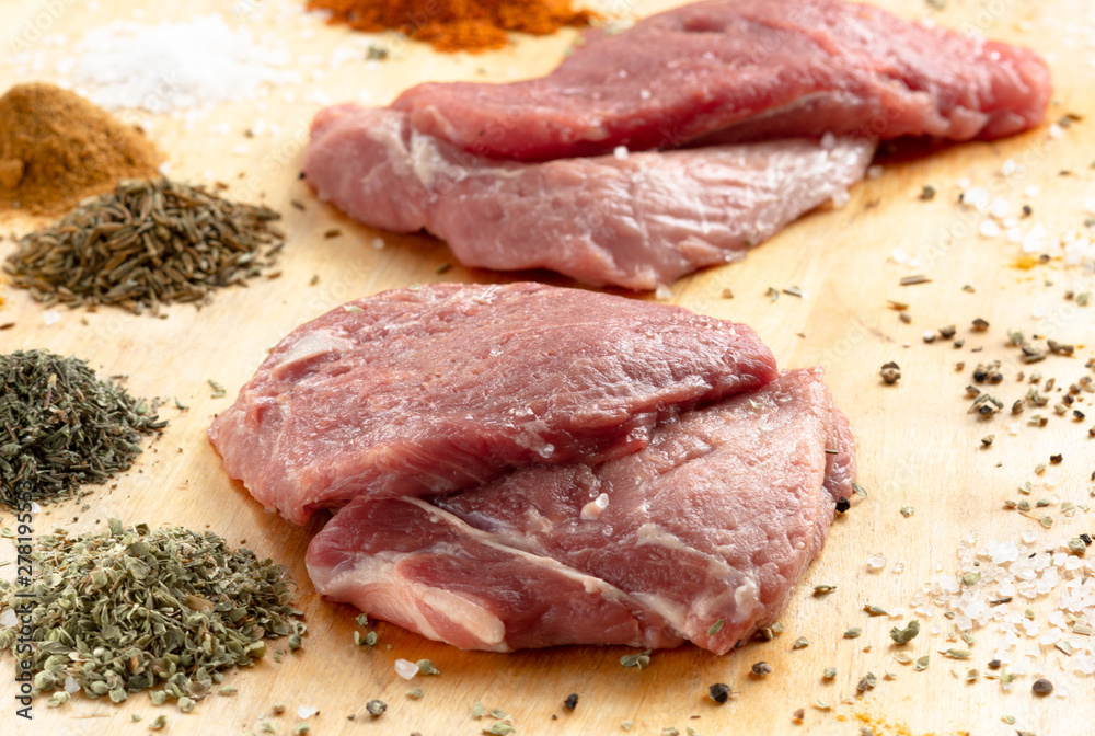 Fototapeta premium raw meat on wooden board
