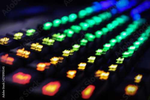 Obraz na płótnie Blurred illuminated multicolor gaming keyboard