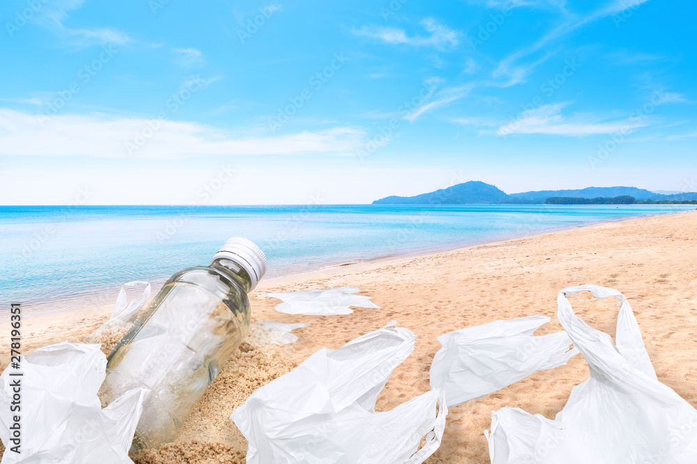 Glass bottles and plastic bags on the beach, the concept of reducing plastic bags Glass bottles and plastic bags on the beach, the concept of reducing plastic bags