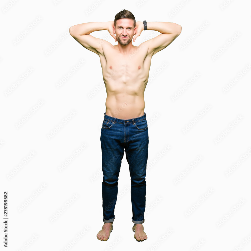 Handsome shirtless man showing nude chest Relaxing and stretching with arms and hands behind head and neck, smiling happy Handsome shirtless man showing nude chest Relaxing and stretching with arms and hands behind head and neck, smiling happy