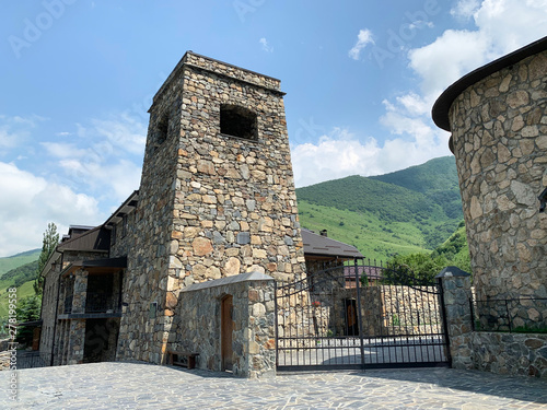 Khidikus. Ancestral tower of Gusov family, 17th century, was restored in 2010. Alan dormition monastery. Russia, North Ossetia, Fi photo