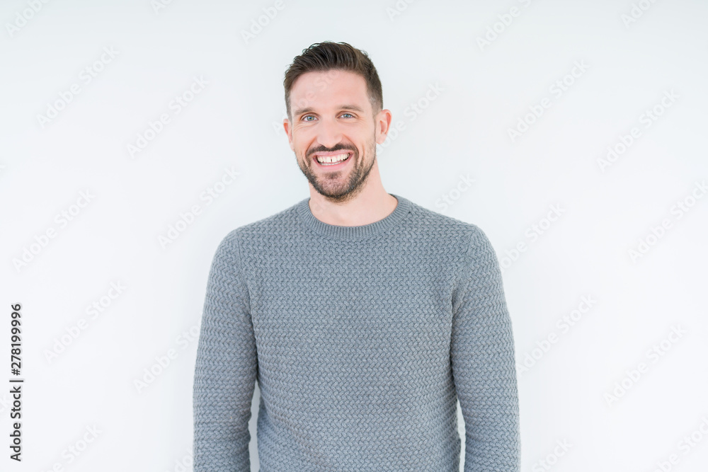 Young handsome man wearing casual sweater over isolated background with a happy and cool smile on face. Lucky person. Young handsome man wearing casual sweater over isolated background with a happy and cool smile on face. Lucky person.