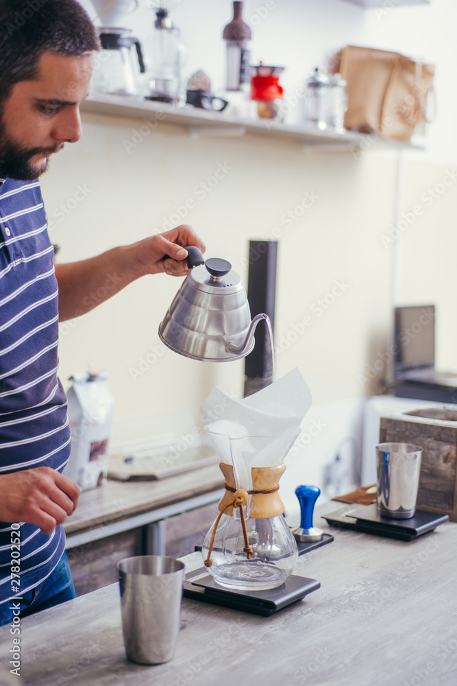 Hand drip coffee Barista pouring water on coffee ground with filter Hand drip coffee Barista pouring water on coffee ground with filter