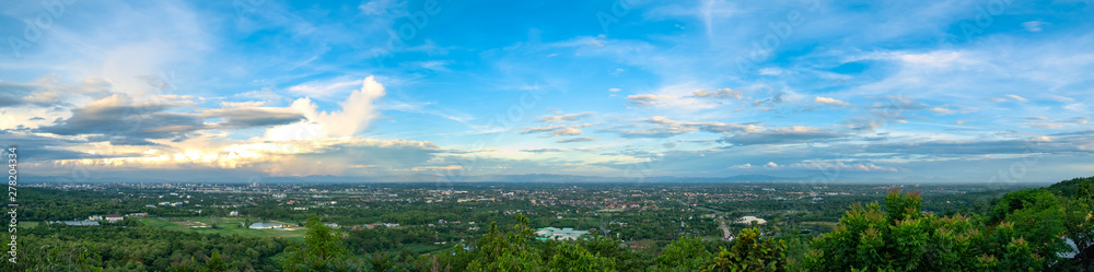 panoramic aerial view of edge of city and mountain