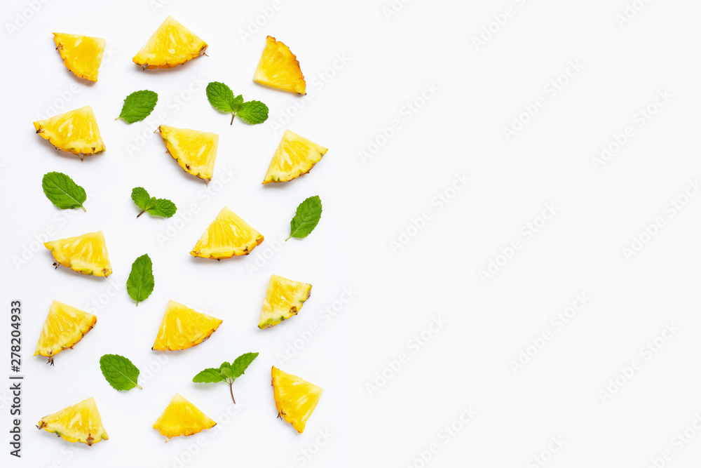 Fresh pineapple with mint leaves on white