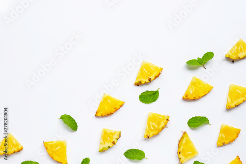 Summer fruit. Sliced pineapple on white. Copy space © Bowonpat