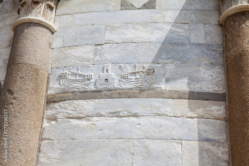 Detail of the stone carvings on the walls of the Leaning Tower of Pisa photo