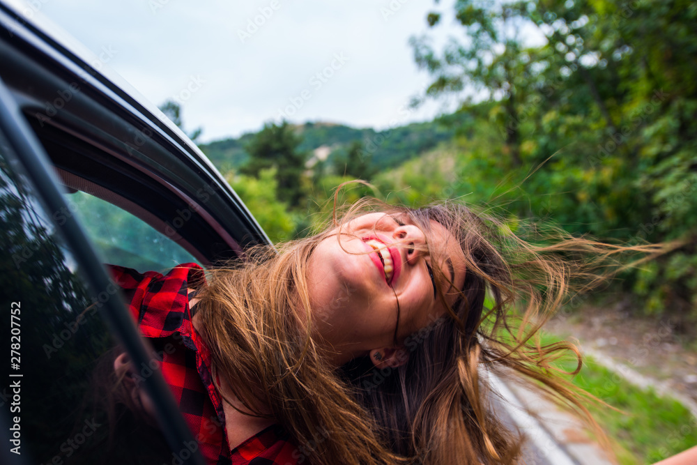 Woman smiling in a car