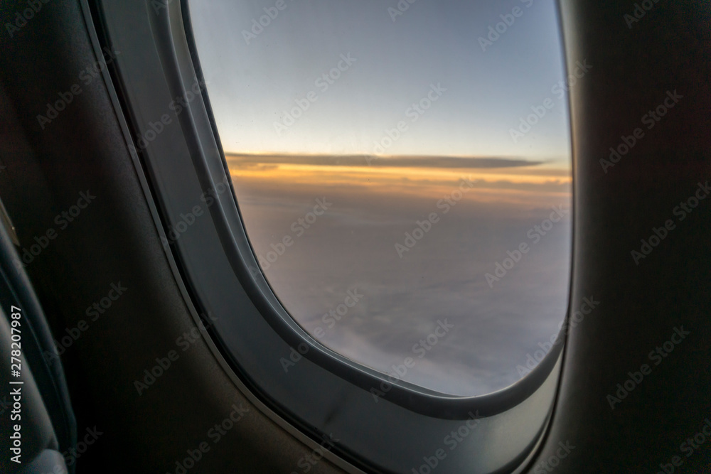 view from aircraft window during sunrise