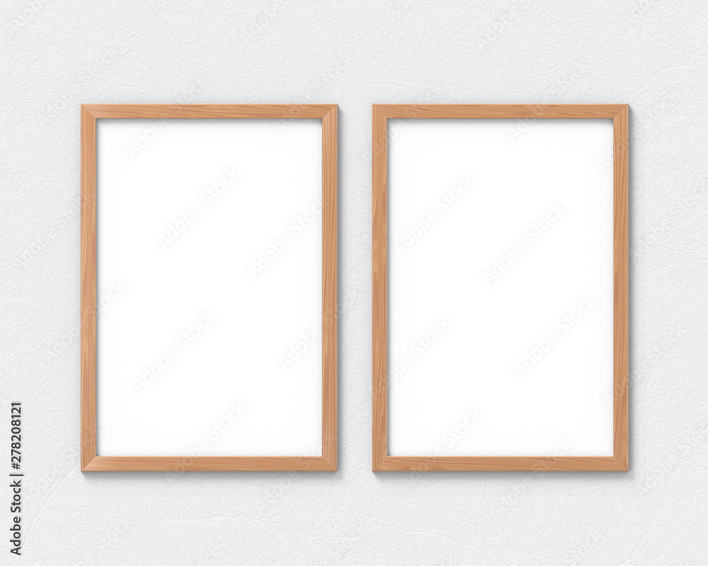 Set of 2 vertical wooden frames mockup with a border hanging on the wall. Empty base for picture or text. 3D rendering.
