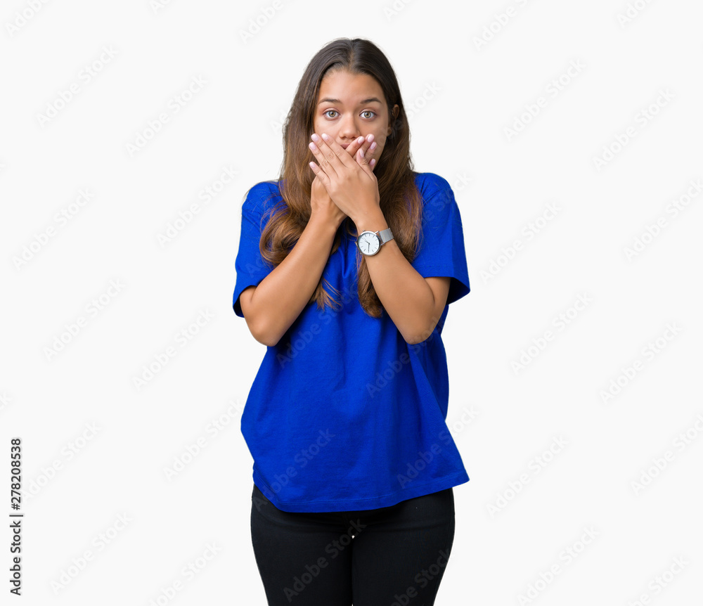 Young beautiful brunette woman wearing blue t-shirt over isolated background shocked covering mouth with hands for mistake. Secret concept. Young beautiful brunette woman wearing blue t-shirt over isolated background shocked covering mouth with hands for mistake. Secret concept.