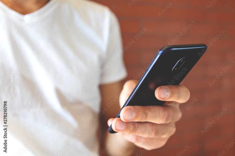 big smartphone in guy's hand, close-up