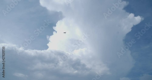 4K Overhead flying aircraft landing at sunset or sunrise