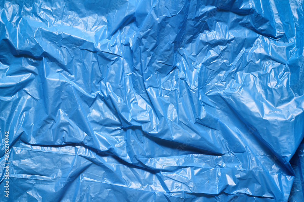 Blue plastic bag texture background. Waste recycling concept. Crumpled