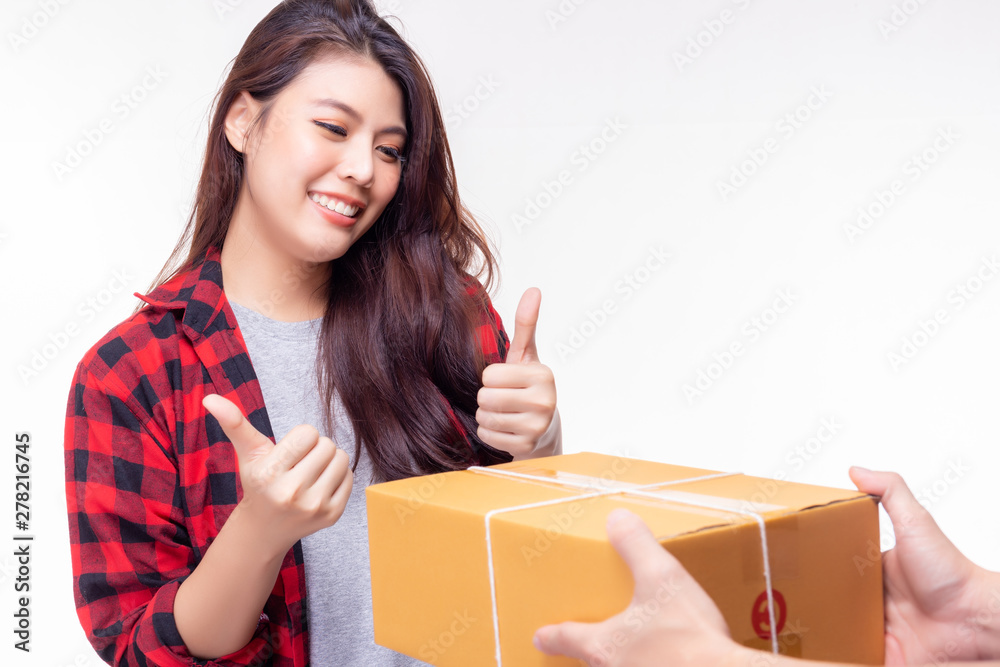 Goods delivery send package to beautiful woman very quickly. It send from foreign country. Attractive beautiful girl get satisfied it and give thumbs up with smile face. copy space, isolated on white Goods delivery send package to beautiful woman very quickly. It send from foreign country. Attractive beautiful girl get satisfied it and give thumbs up with smile face. copy space, isolated on white