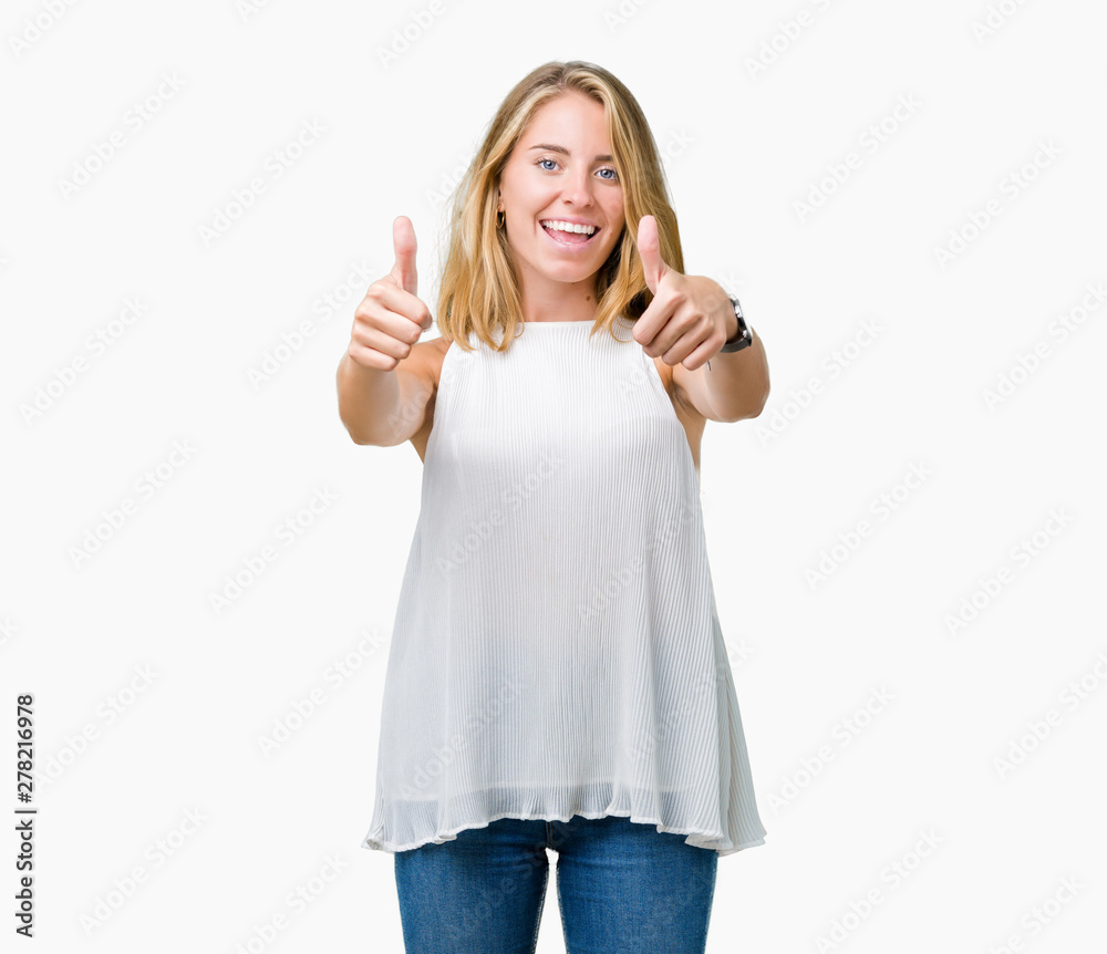 Beautiful young elegant woman over isolated background approving doing positive gesture with hand, thumbs up smiling and happy for success. Looking at the camera, winner gesture. Beautiful young elegant woman over isolated background approving doing positive gesture with hand, thumbs up smiling and happy for success. Looking at the camera, winner gesture.