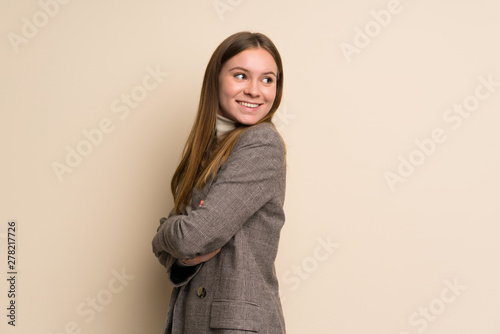 Young business woman with arms crossed and happy