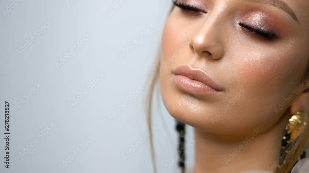 Beauty portrait of model face with bright blue eyes skin care concept.