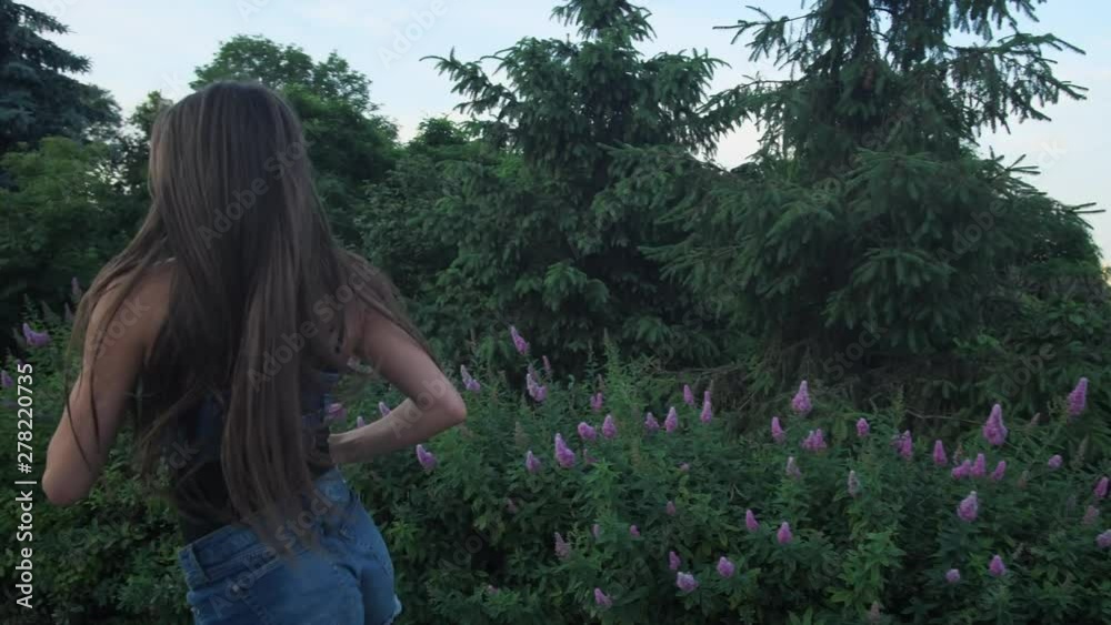 The girl in short shorts is engaged in outdoor sports. She runs in angoo jumps shoes. 4K Slow Mo The girl in short shorts is engaged in outdoor sports. She runs in angoo jumps shoes. 4K Slow Mo