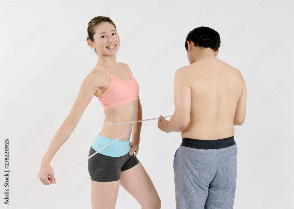 小太りの男性とスタイルのいい女性 Stock Photo Adobe Stock
