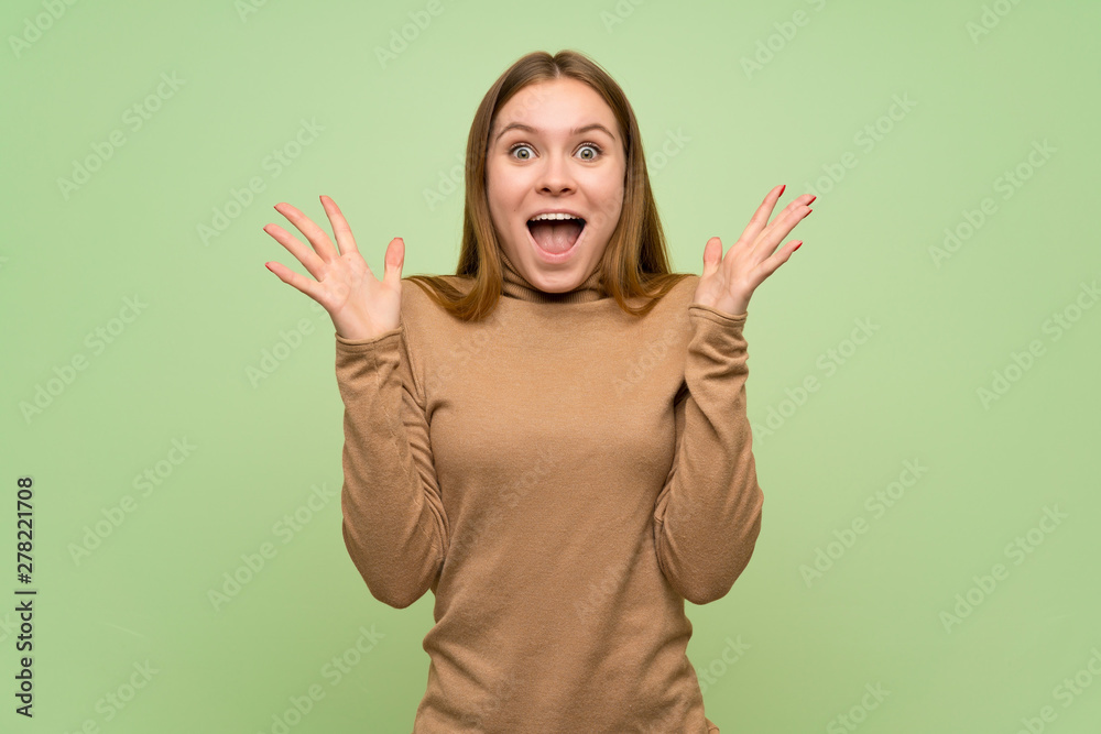 Young woman with turtleneck sweater with shocked facial expression Young woman with turtleneck sweater with shocked facial expression