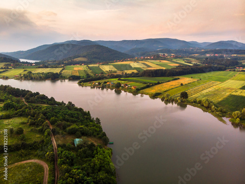 Aerial view of lake, forest and agriculture field by the water, at summer. Gruza lake near the Kragujevac in Serbia. photo