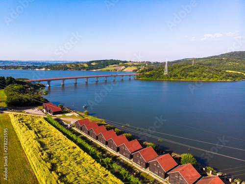 Aerial view of lake, forest and agriculture field by the water, at summer. Gruza lake near the Kragujevac in Serbia. photo