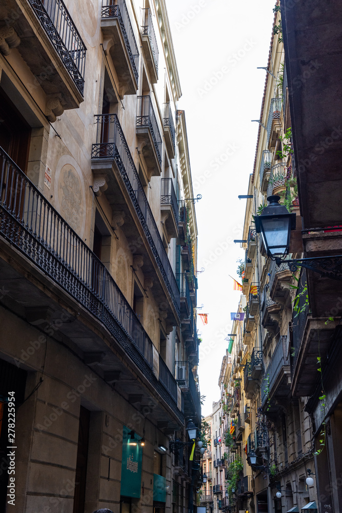 Narrow ancient city street in Barrio Gotic. Barcelona.