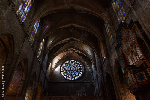 Esglesia de Santa Maria del PI, detail of the magnificent rose window and the pipe organ on the side. Barcelona.