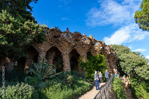 Parc Guell, detail of Portico della Lavandaia, surrounded by wild nature. Barcelona. photo