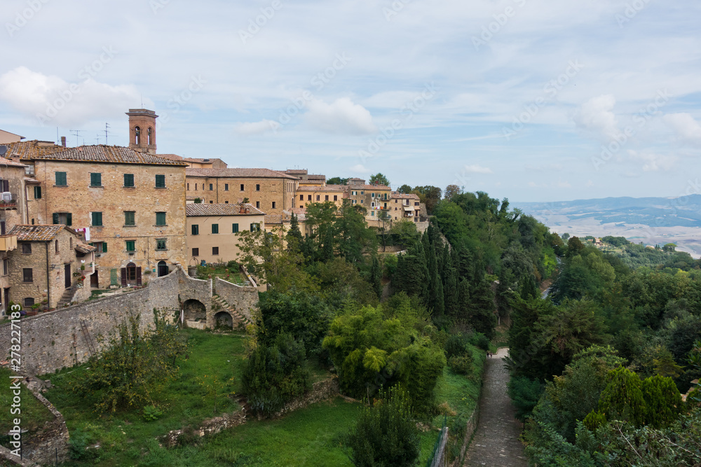 Cityscape and surrounding landscape, a view from city walls of Voltera in Tuscany, Italy