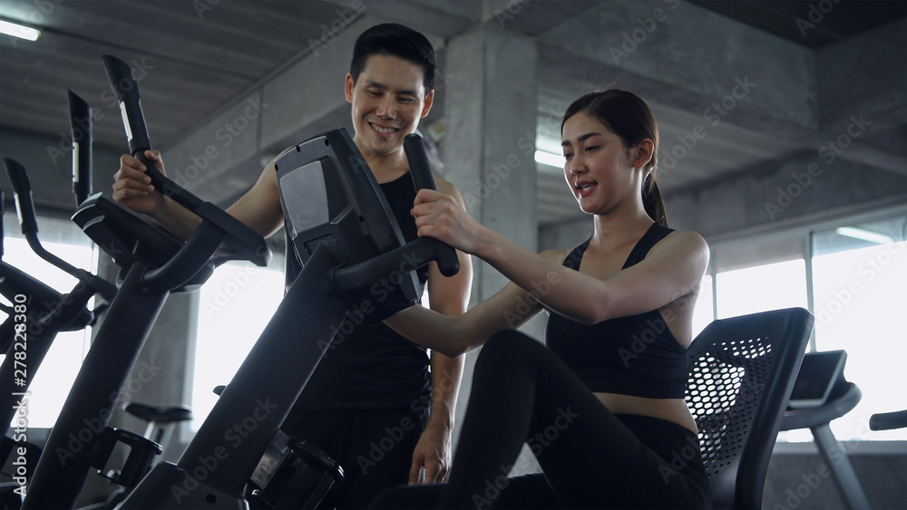 Concept of physical exercise Teens are cycling to lose weight in the gym. Concept of physical exercise Teens are cycling to lose weight in the gym.