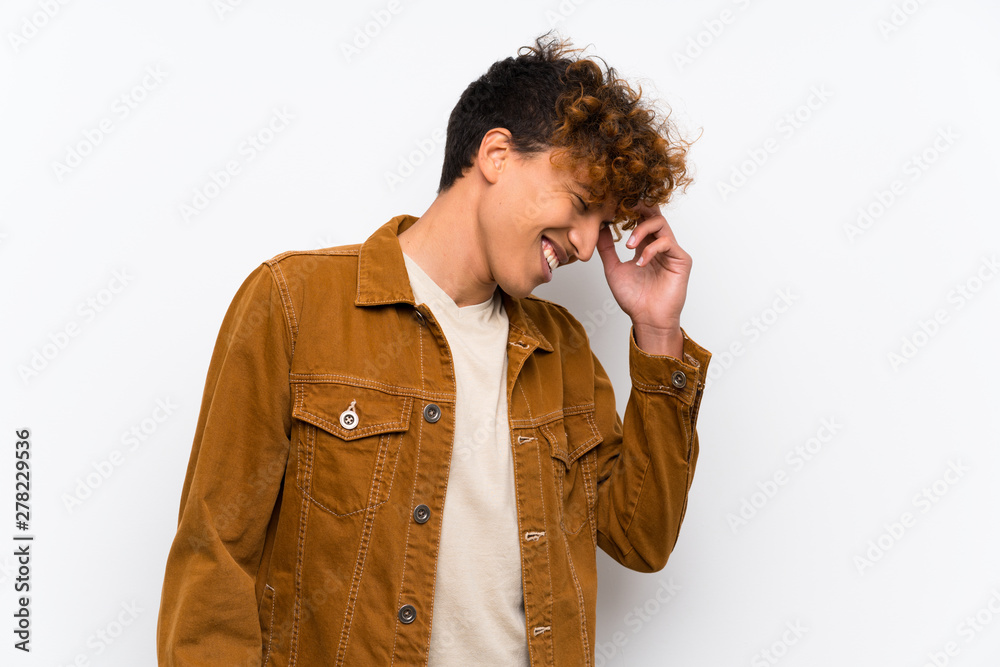 Young african american man over isolated white wall laughing