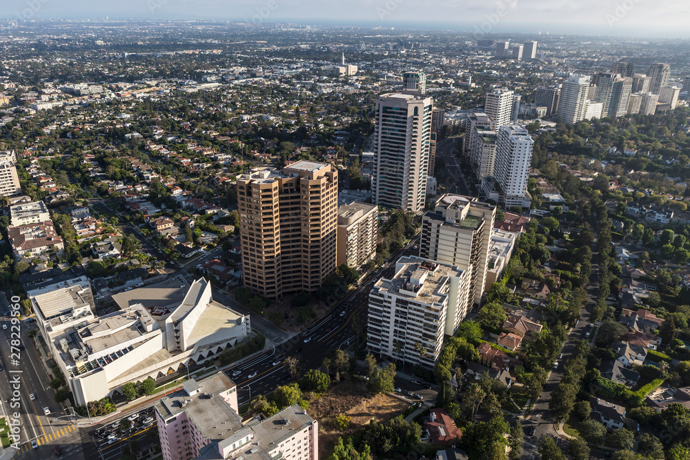 Aerial view of partment towers, streets and homes along the Wilshire Blvd in West Los Angeles, California.