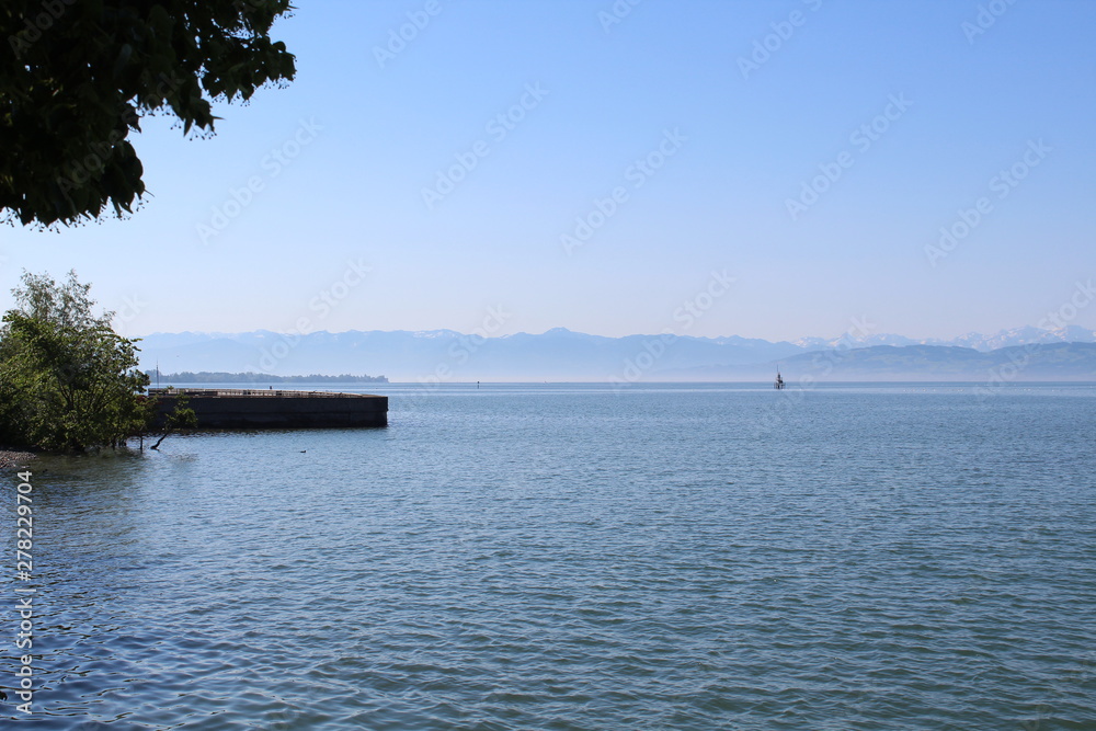 View over Lake Constance on the snow peaks of the Alps on a very clear day View over Lake Constance on the snow peaks of the Alps on a very clear day