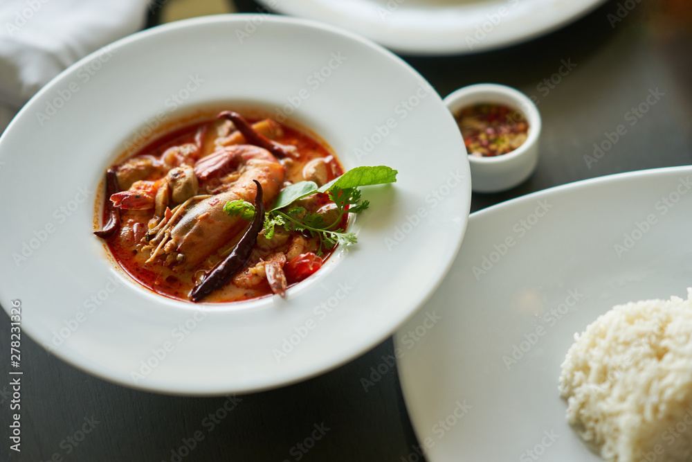 Tom yam kung with rice and fish sauce dip in Thai traditional famous dish Tom yam kung with rice and fish sauce dip in Thai traditional famous dish