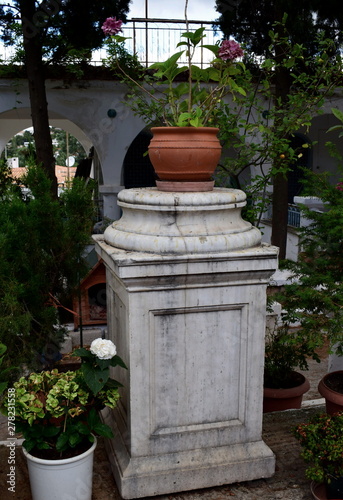 flowerpot on a marble column